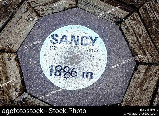 The pastille marking the summit of Puy de Sancy at 1886 meters altitude