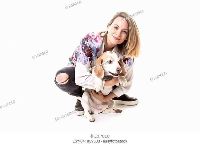 A Dog with woman are posing in studio - isolated on white background