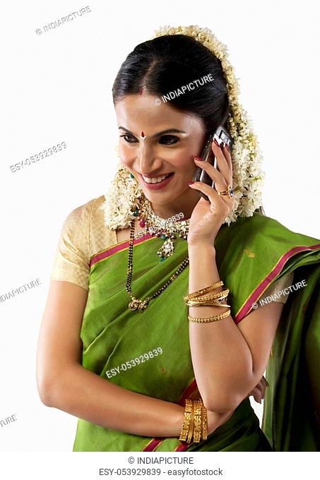 South Indian woman talking on a mobile phone