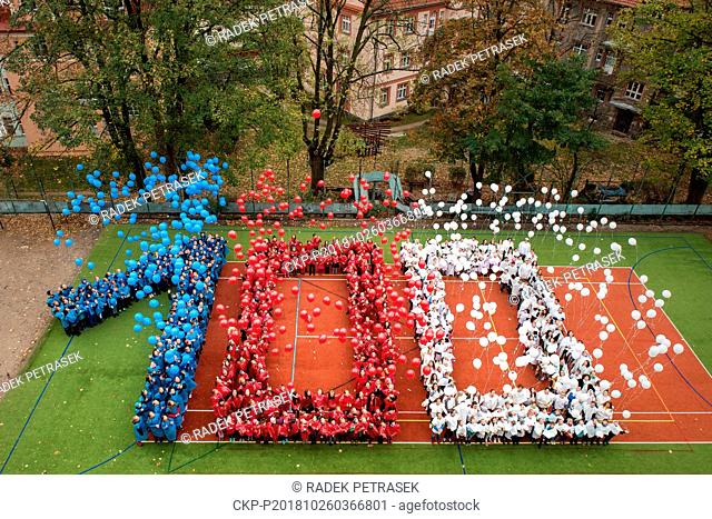 520 pupils and teachers of the Hus elementary school in Liberec, stand in the form of digit 100, dropped balloons in Czech national colors with the wish for the...