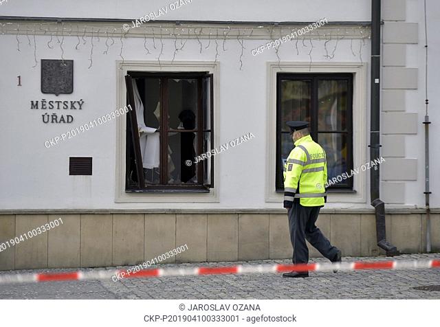 A policeman patrols in front of the town hall in Rymarov on Wednesday, April 10, 2019, where an explosion rocked the whole of the first floor and the detonation...