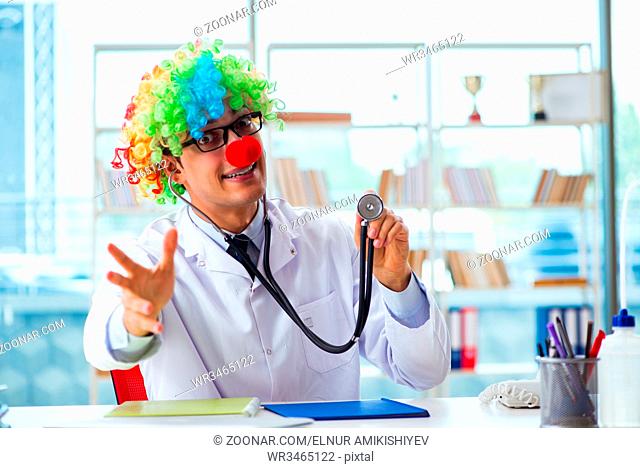 Funny pediatrician with clown wig in the hospital clinic