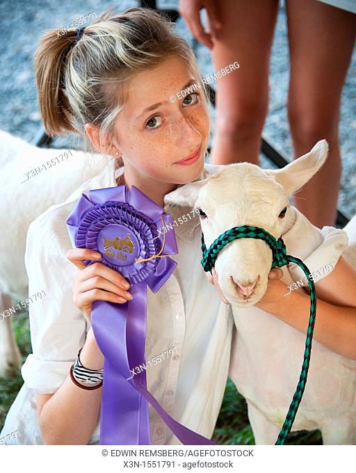 Girl with ribbon winning lamb at the Mason Dixon Fair
