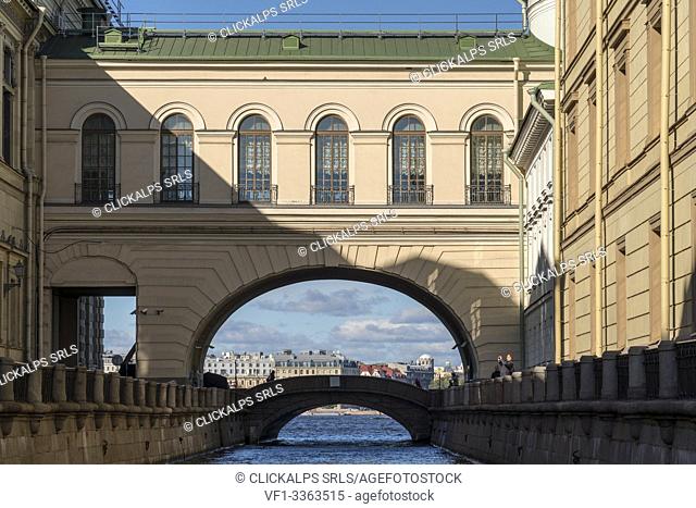 Arch and Hermitage Bridge over Winter Canal, connecting Old Hermitage and Hermitage Theater. Saint Petersburg, Russia