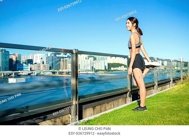 Woman stretching legs at outdoor