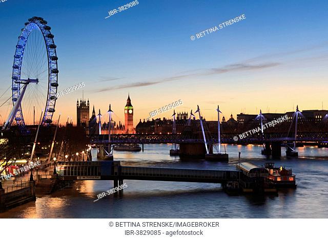 View of the River Thames with the London Eye and the Houses of Parliament at dusk, London, England, United Kingdom