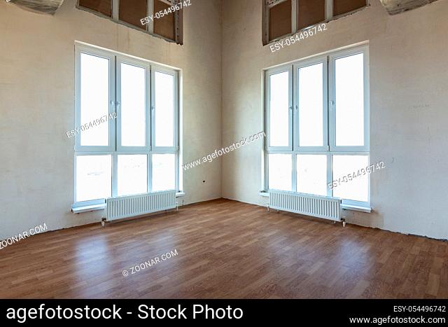 Room interior with two corner stained glass windows