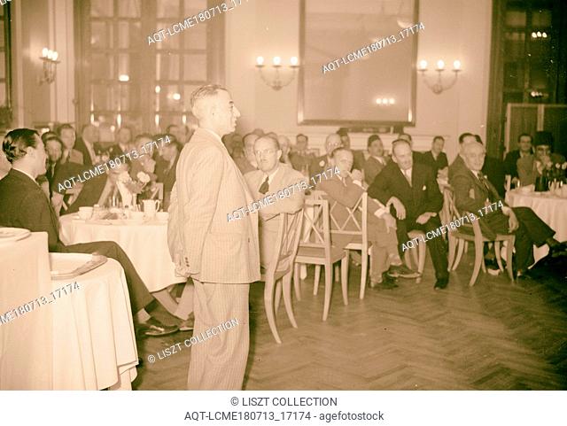 Reception at King David Hotel, Oct. 16, 1940 for Egyptians Ibrahim el-Mazuri. Table group listening to a man making a speech, Jerusalem