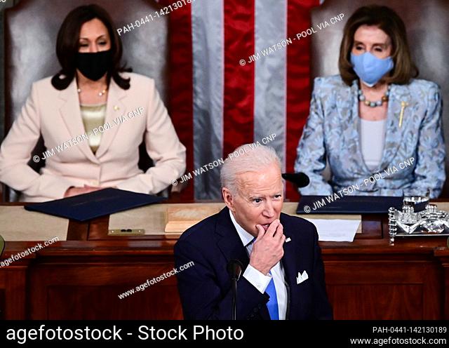 US President Joe Biden addresses a joint session of Congress as US Vice President Kamala Harris (C) and Speaker of the United States House of Representatives...