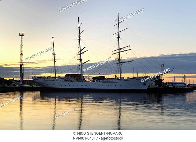 Gorch Fock at sunset, a German three-mast barque, sailing ship, former training ship, now a museum ship, port, Stralsund, UNESCO World Heritage Site