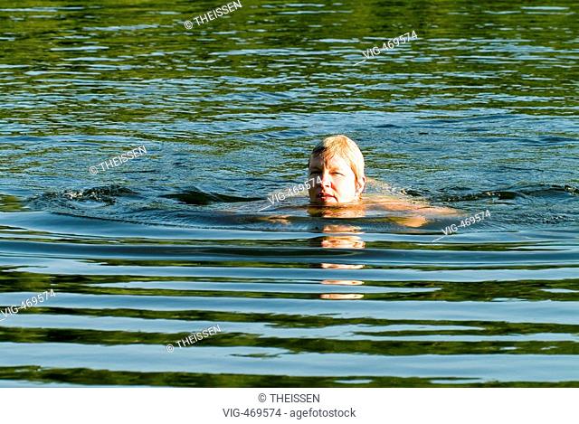 woman swimming in a lake. - 01/01/2007