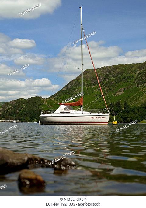 England, Cumbria, Ullswater. A yacht moored on Ullswater, England's most beautiful lake in the Lake District National park