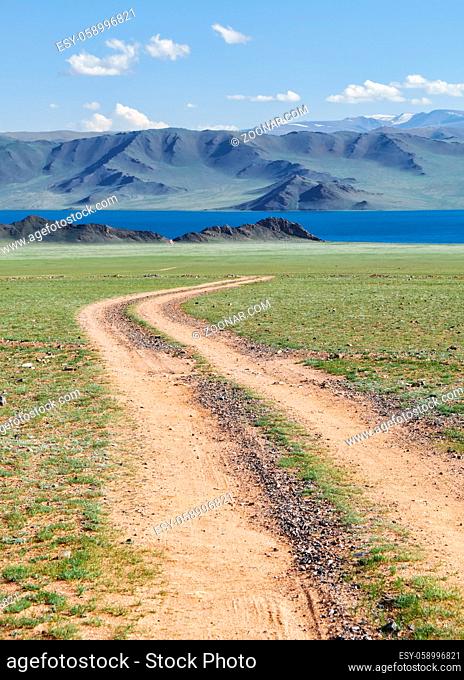 Mongolian natural landscapes with country road to the lake Tolbo-Nuur in north Mongolia
