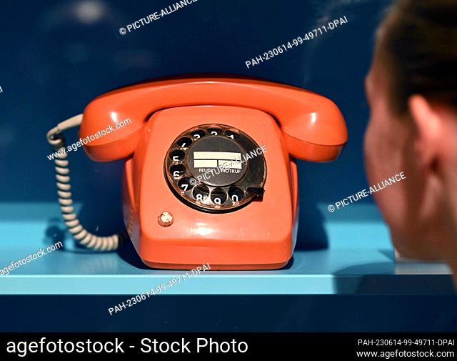 PRODUCTION - 12 June 2023, Baden-Württemberg, Karlsruhe: A telephone with a dial from the Deutsche Bundespost, which was a standard model in West German...
