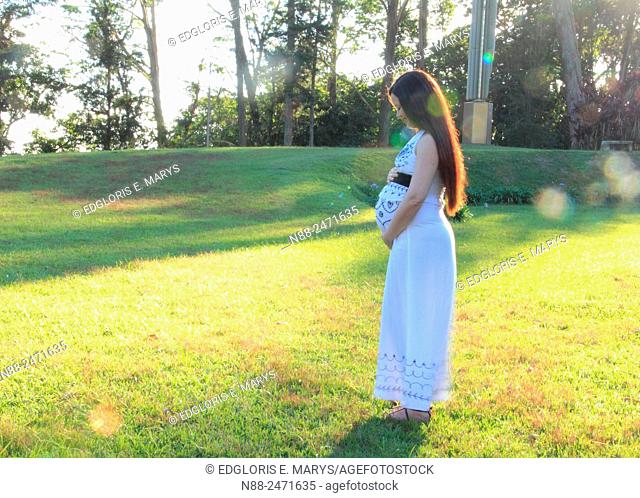 Pregnant woman in park