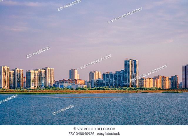 Urban landscape of commuter town on river bank in Kazan, Russia