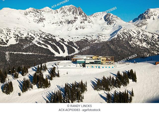 aerial of round horse lodge whistler mountain with blackcomb mountain in background, british columbia, Canada