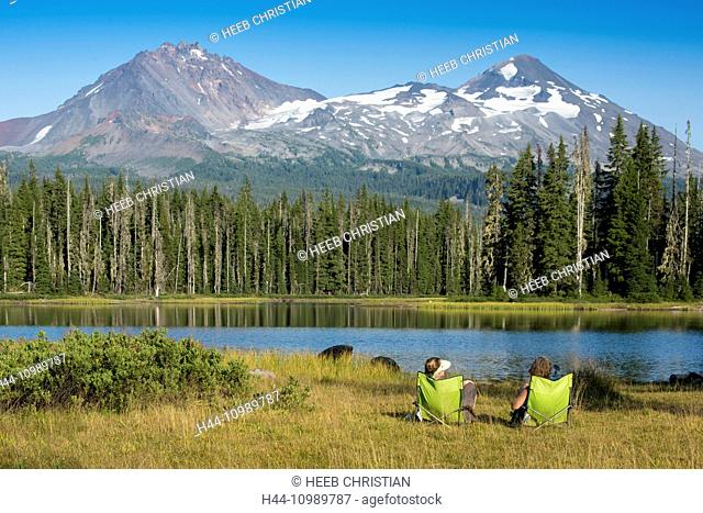 two women sitting in chairs at Scott Lake, Oregon