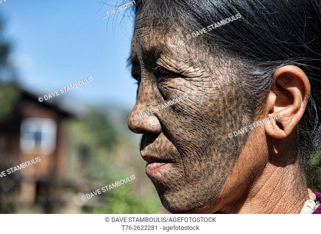 A Ngaya Chin (Daai) woman with face tattoo, Kanpetlet, Myanmar. The tribal Chin women had their faces tattooed when they were around 15 years old