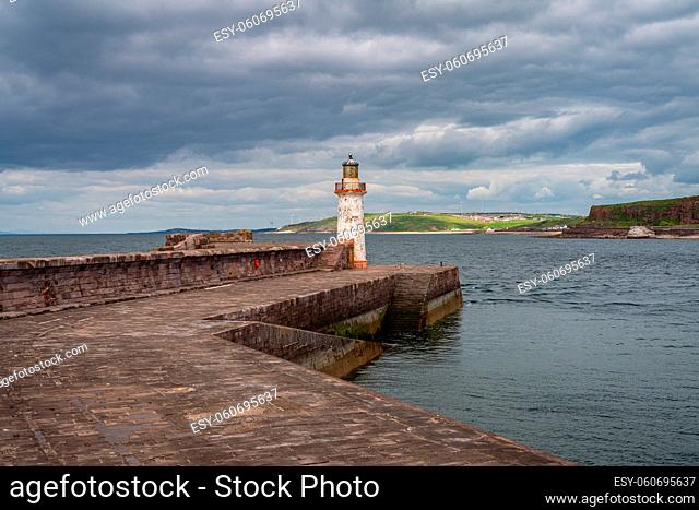 The West Pier and the West Pier Lighthouse in Whitehaven, Cumbria, England, UK