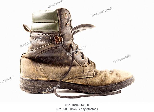 Contain climate amplification old soldier's boots worn with scratches and untied shoelaces on black  background, Stock Photo, Picture And Low Budget Royalty Free Image. Pic.  ESY-028950576 | agefotostock