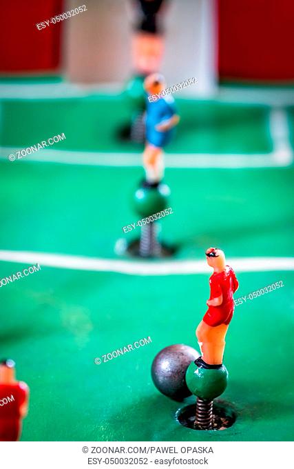 Close-up shot of players figures of a tabletop football game