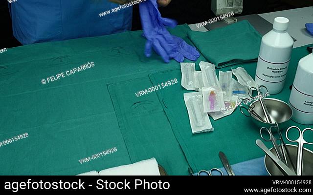 Nurse preparing medication for parenteral nutrition in a hospital, conceptual image