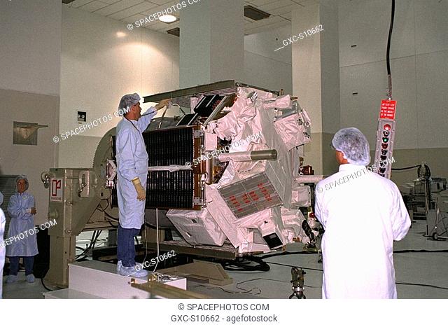 07/24/1997 --- Applied Physics Laboratory engineers and technicians from Johns Hopkins University test solar array deployment of the Advanced Composition...