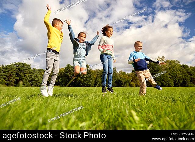happy children jumping at park