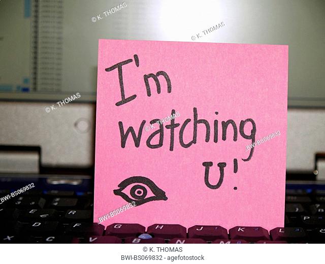 memo note on notebook, I'm watching u, drawing of an eye