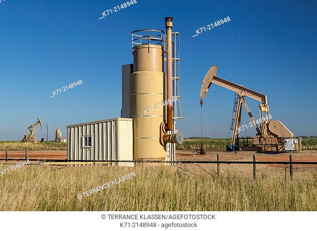 Oil pumpers in the Bakken play oil fields near Williston, North Dakota, USA