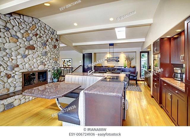 Luxury mohogany Kitchen with modern furniture and stone fireplace