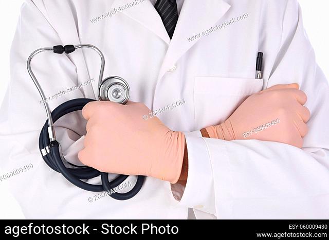 Closeup of a doctor in lab coat with his arms folded and a stethoscope in his hand