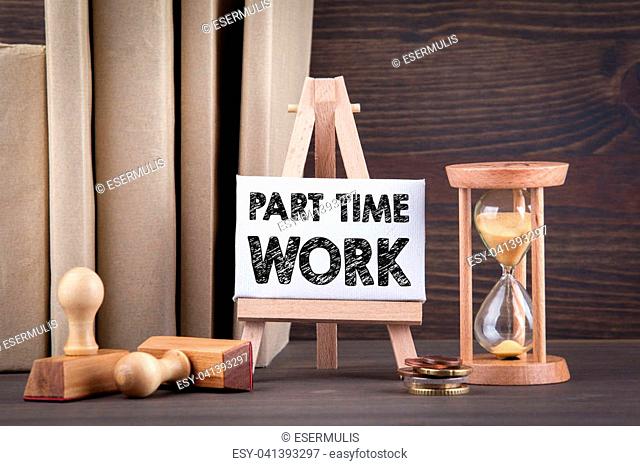 Part time work. Sandglass, hourglass or egg timer on wooden table showing the last second or last minute or time out