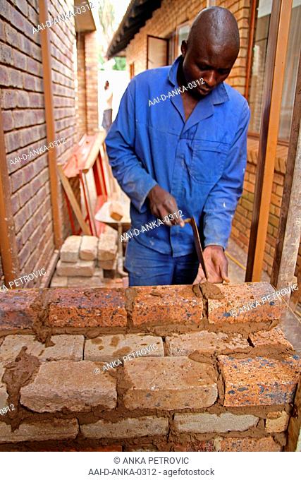 Brick layer laying bricks, Moreleta Park, Pretoria, Gauteng Province, South Africa