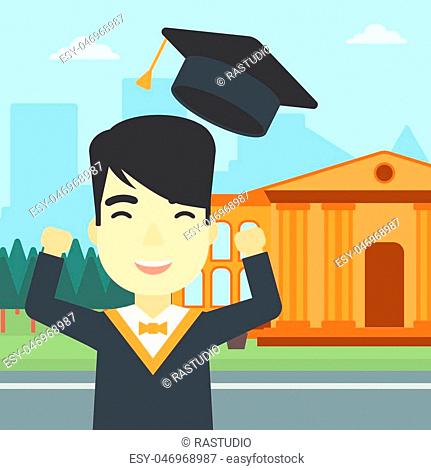 An asian excited graduate in cloak and graduation hat. Graduate throwing up his hat. Graduate celebrating on a background of educational building