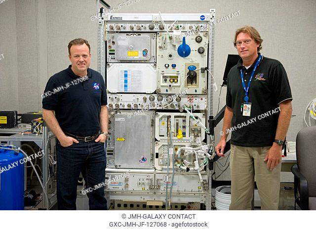 NASA astronaut Ron Garan (left), Expedition 2728 flight engineer, and crew instructor Wayne Wright, pose for a photo during a payload training session on Device...