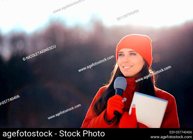 Professional journalist working on field in wintertime
