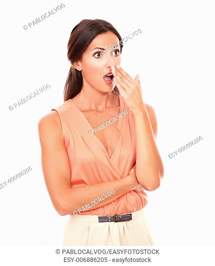 Pretty latin lady with hand gesturing error while looking to her left embarrassed and surprised in white background - copyspace