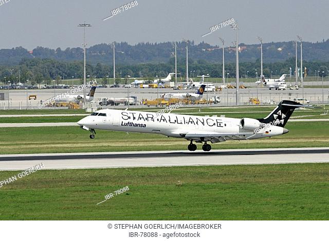 Munich, GER, 11. Aug. 2005 - A Lufthansa StarAlliance-Jet of type Canadair CRJ750 touch down at Munich Airport