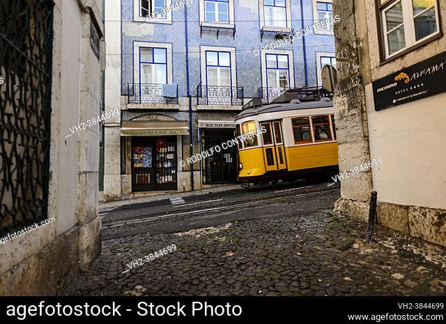 Tram in Alfama streets, Lisbon (Portugal)