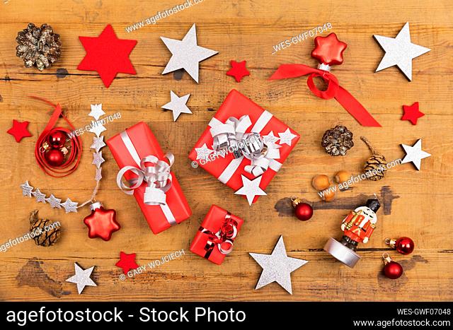 Collection of Christmas themed items flat laid on wooden surface