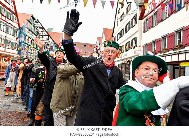 Prime Minister of Baden-Wuerttemberg Winfried Kretschmann (The Greens, 2.f.r.) can be seen dressed up in a jester costume during the Shrove Tuesday carnival...