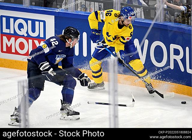From left Sami Vatanen of Finland and Mathias Brome of Sweden in action during the Group B Ice Hockey World Championship match between Finland and Sweden in...