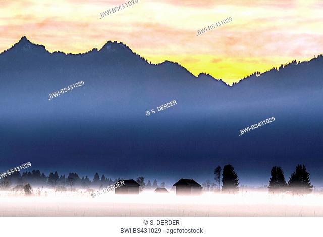 autumnal mist over the Murnauer Moos shortly after sunset with view onto Laber and Ettaler Manndl, Germany, Bavaria, Oberbayern, Upper Bavaria, Murnauer Moos