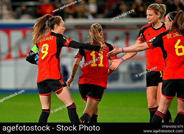 Belgium's Tessa Wullaert (L) celebrates with teammates after scoring during a friendly soccer match between Belgium's national women's team the Red Flames and...