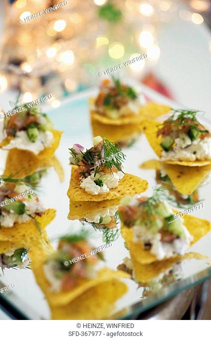 Nachos with soft cheese and smoked salmon
