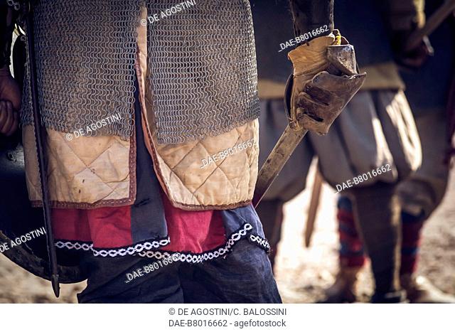 Warrior with sword, chainmail and gambeson, Festival of Slavs and Vikings, Centre of Slavs and Vikings, Jomsborg-Vineta, Wolin island, Poland
