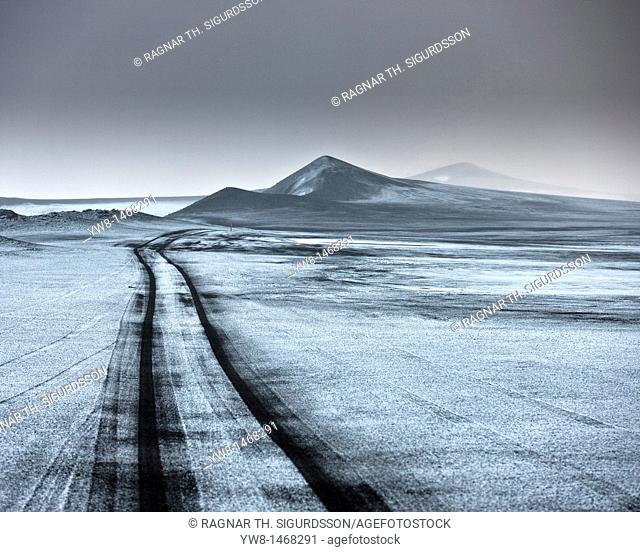 Light snow on ash filled landscape wth jeep tracks off road  Iceland  Asf fall from the Grimsvotn, volcano eruption which began on May 21, 2011