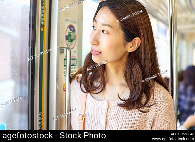 Young Japanese woman on a train